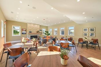 Clubhouse dining area with fireplace and seating